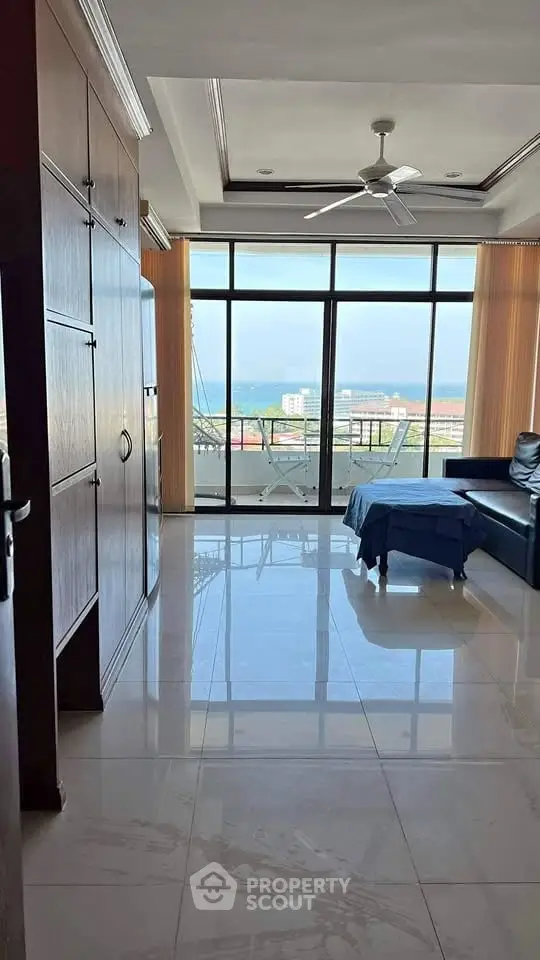 Spacious living room with ocean view and large balcony access