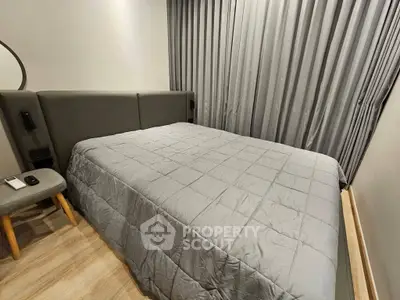 Cozy bedroom with modern gray decor and comfortable bedding