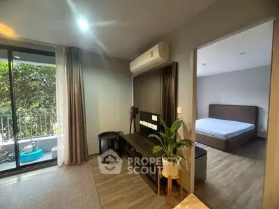 Modern apartment interior with balcony view and bedroom access