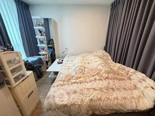 Cozy bedroom with ample storage and natural light