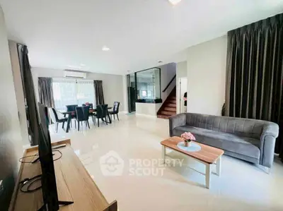 Spacious modern living room with elegant dining area and stylish decor