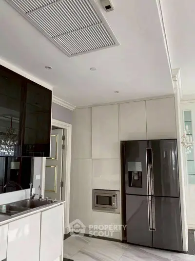 Modern kitchen with sleek cabinetry and stainless steel appliances