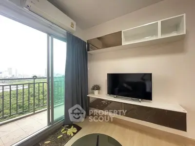 Modern living room with balcony view and sleek TV setup
