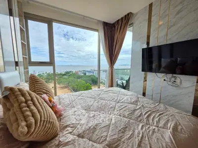 Luxurious bedroom with stunning ocean view and modern decor