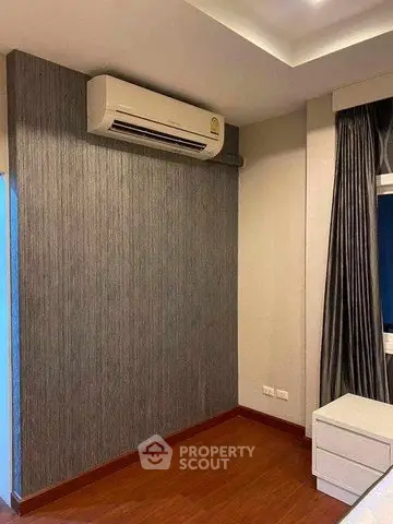 Modern bedroom with air conditioning and stylish decor