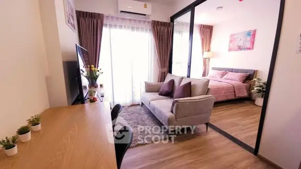 Modern studio apartment with cozy living area and stylish bedroom