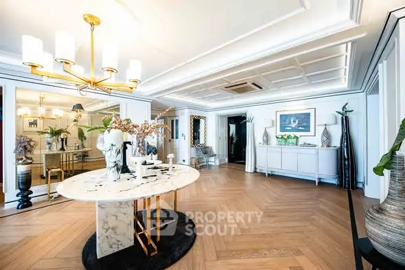 Luxurious living room with elegant decor and marble table in a spacious open layout.