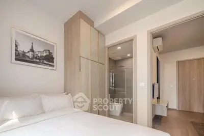 Modern bedroom with ensuite bathroom in a stylish apartment