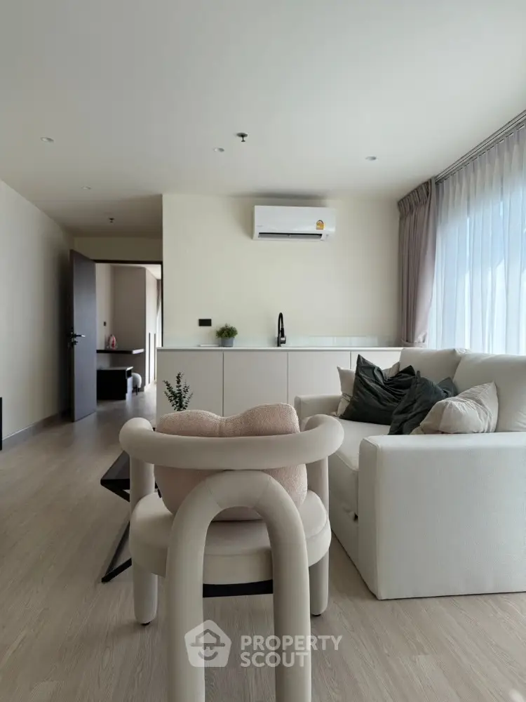 Modern living room with stylish furniture and natural light