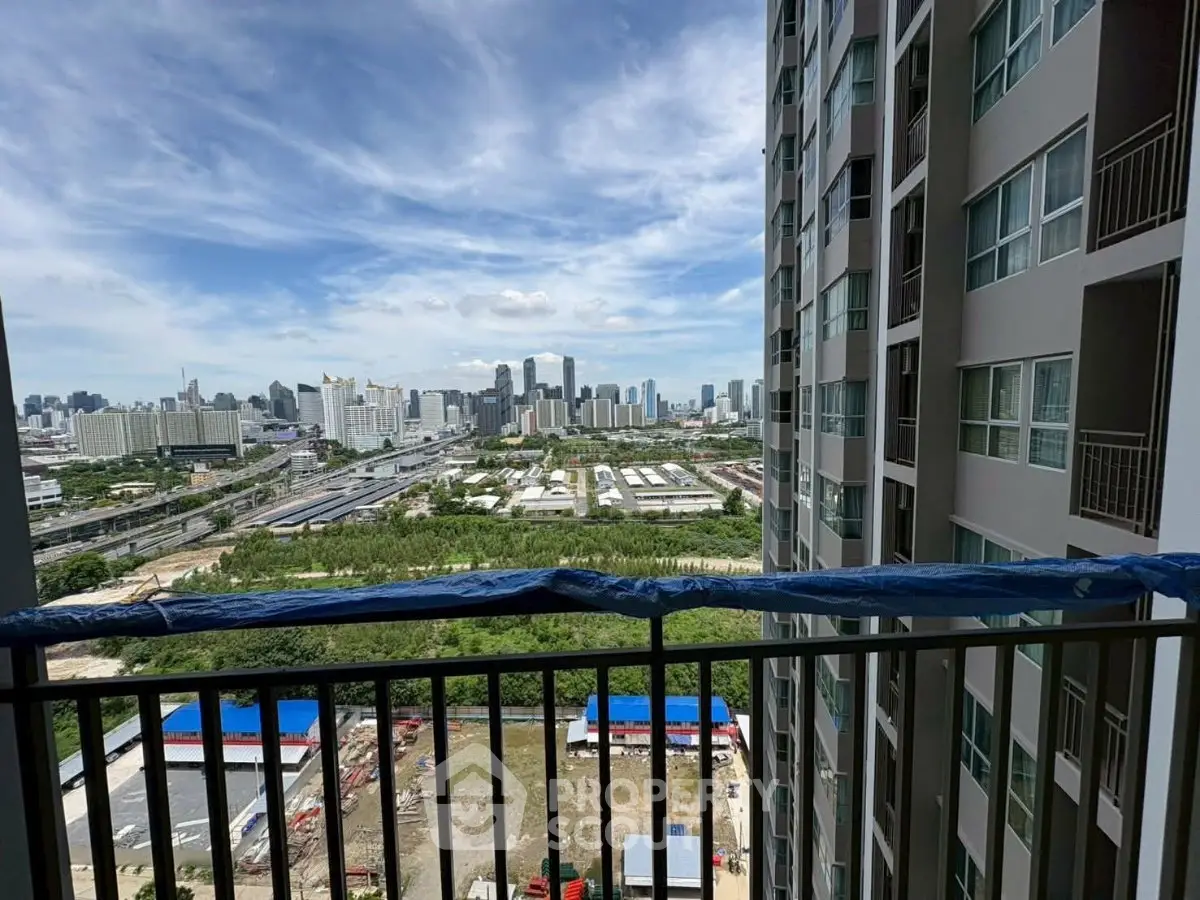 Stunning cityscape view from high-rise balcony, perfect for urban living enthusiasts.