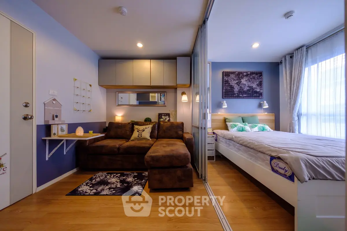 Modern studio apartment with cozy living area and stylish bedroom