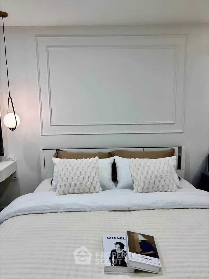 Elegant bedroom with stylish decor and cozy bedding, perfect for relaxation and comfort.