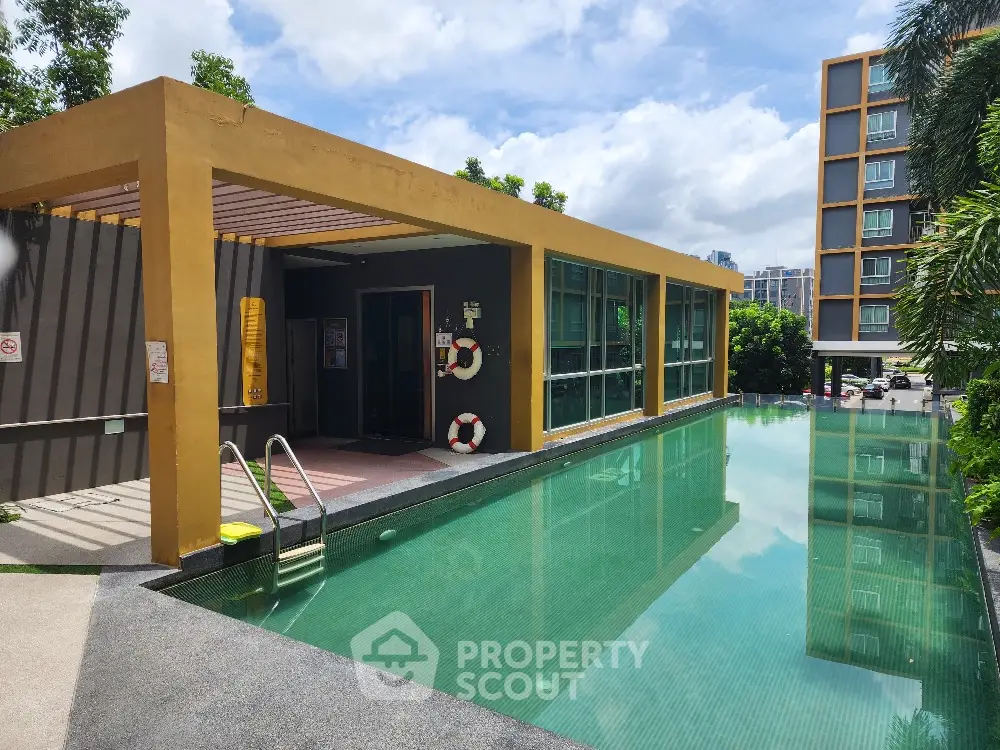 Luxurious poolside living with modern amenities, surrounded by lush greenery and a high-rise urban backdrop, perfect for upscale relaxation and entertainment.
