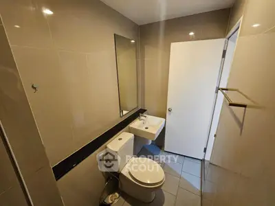 Modern bathroom with sleek design and compact layout