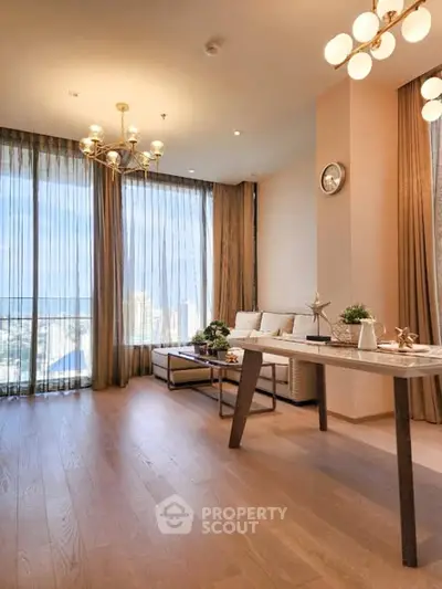 Spacious living room with elegant decor and city view, featuring modern lighting and floor-to-ceiling windows.