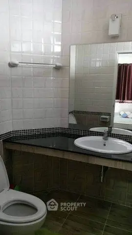Modern bathroom with sleek sink and large mirror