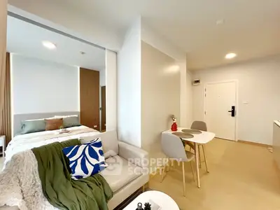 Modern studio apartment with cozy living area and stylish decor
