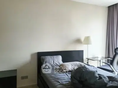 Cozy bedroom with modern furnishings and natural light