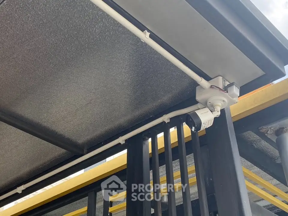 Modern building exterior with security camera and sleek design