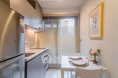 Modern kitchen with sleek design and cozy dining area