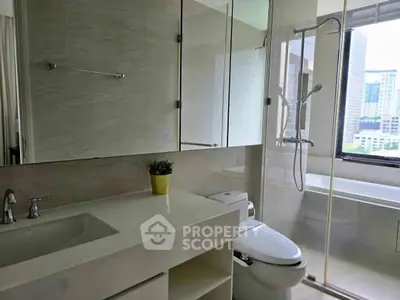 Modern bathroom with city view, featuring sleek fixtures and a bathtub for relaxation.