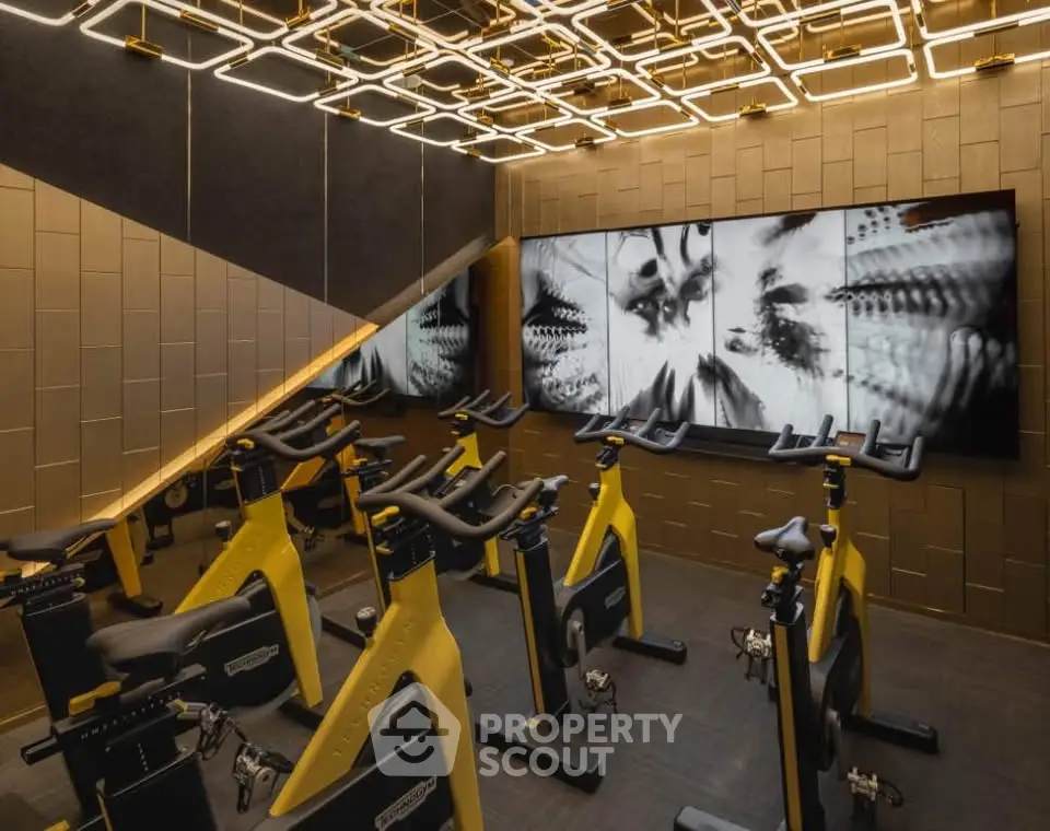 Luxurious indoor cycling gym with modern design and high-end equipment.