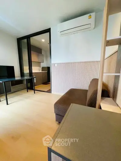 Modern living room with air conditioning and open kitchen layout