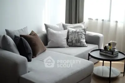 Modern living room with stylish gray sofa and chic decor