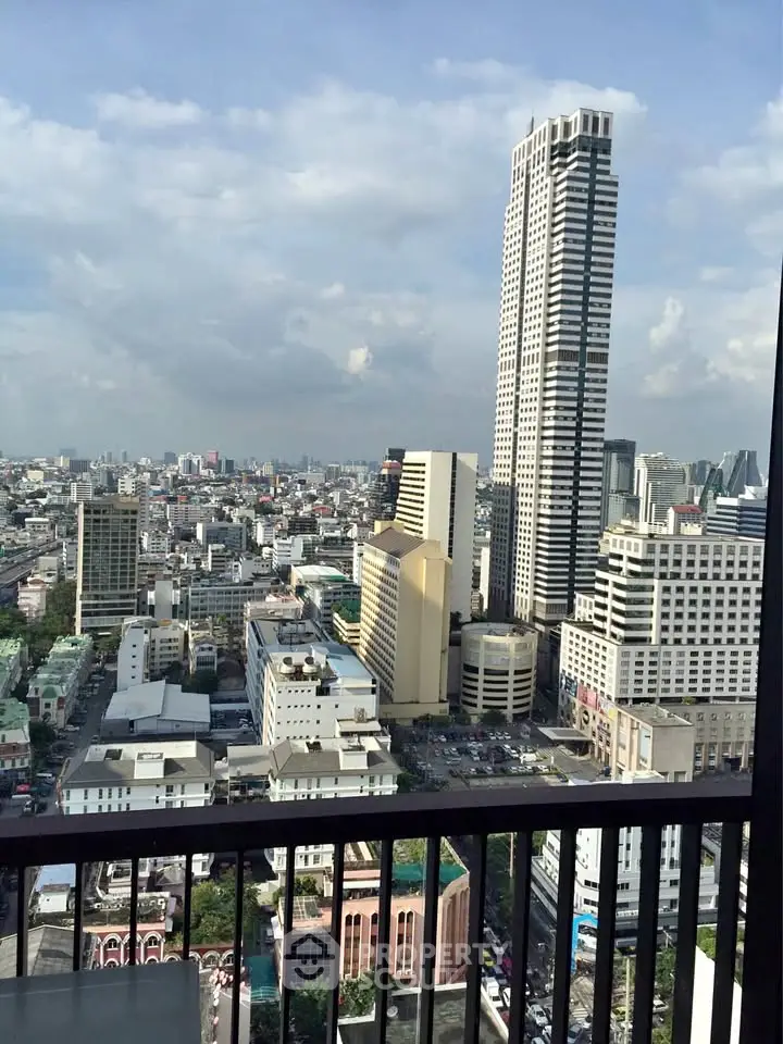 Stunning cityscape view from a high-rise balcony showcasing urban skyline and towering skyscrapers.