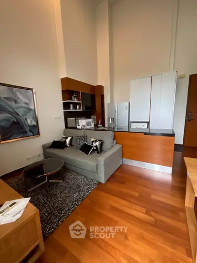 Modern living room with open kitchen and stylish decor