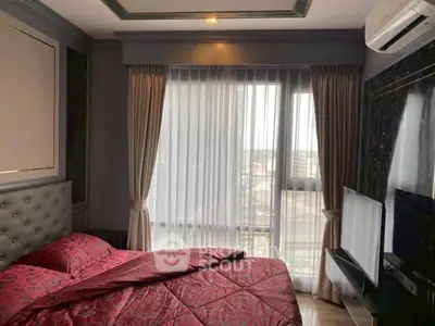 Luxurious bedroom with elegant decor and large window view