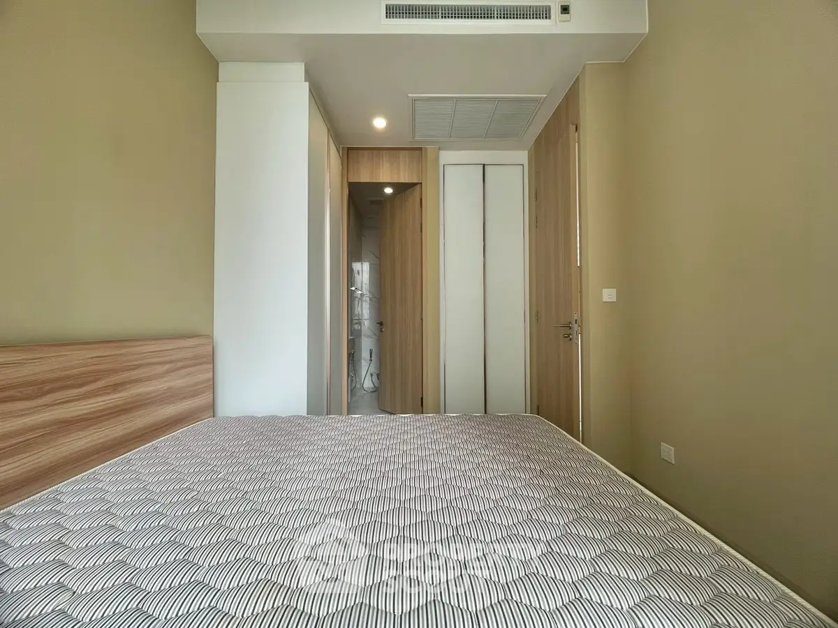Modern bedroom with wooden accents and en-suite bathroom