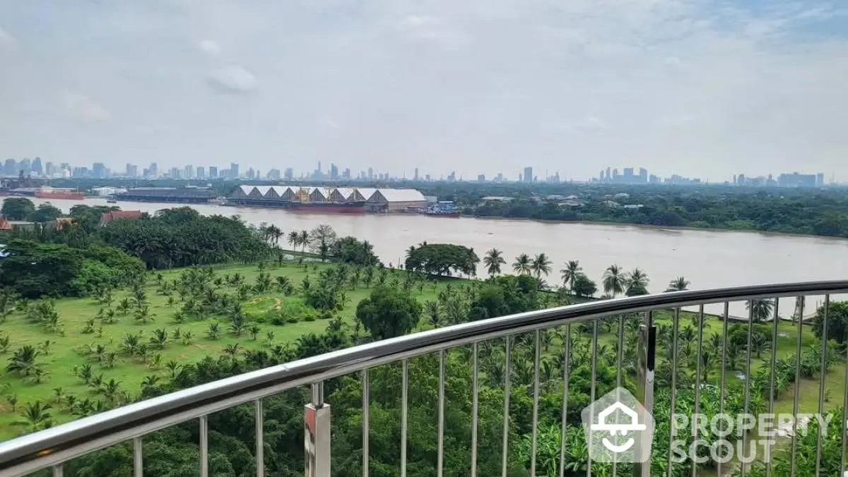 Stunning river and city skyline view from a spacious balcony, perfect for relaxation and enjoying nature.