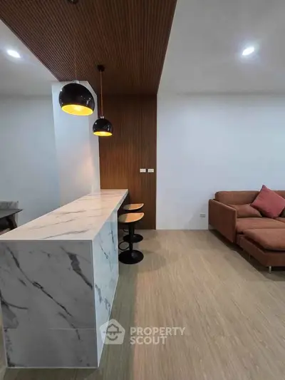 Modern living room with marble countertop and stylish lighting