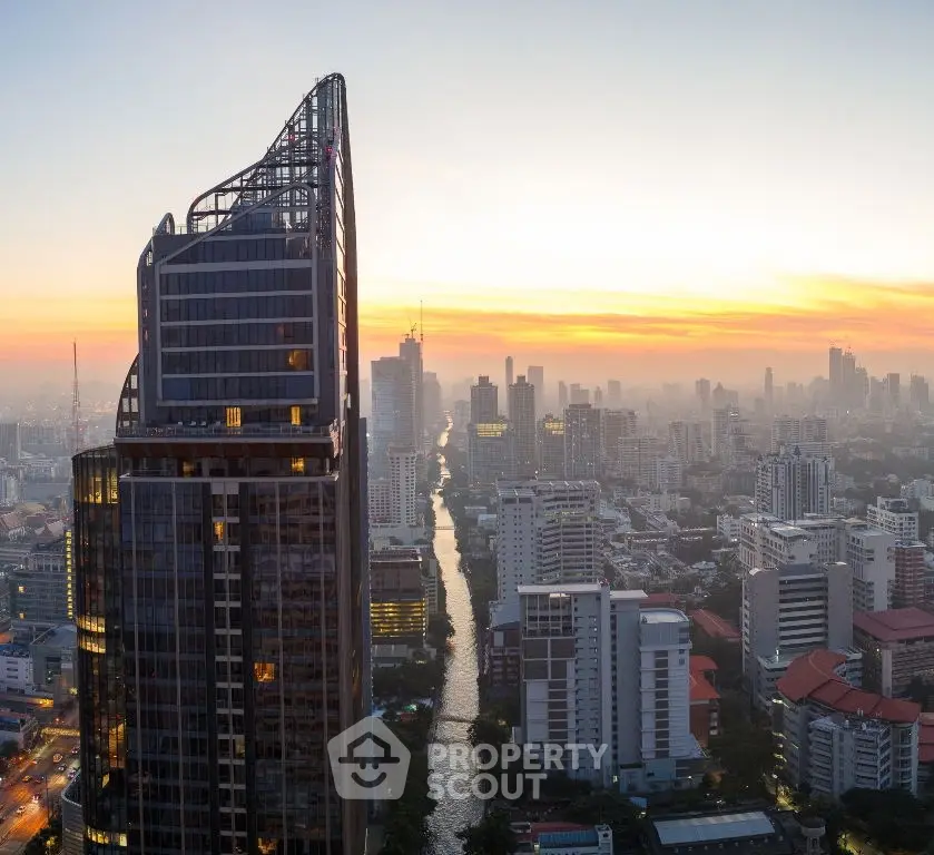 Stunning cityscape view with modern high-rise building at sunset, showcasing urban living at its finest.
