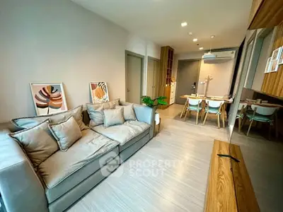 Modern living room with stylish decor and open dining area