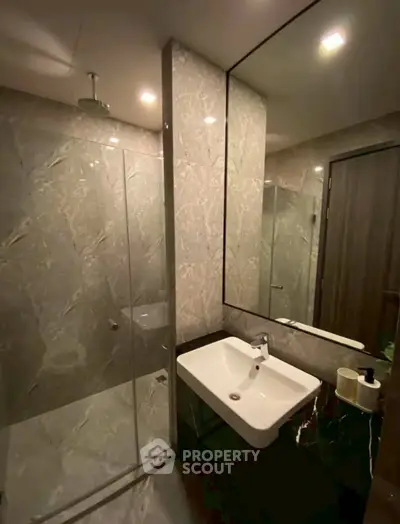 Luxurious modern bathroom with elegant marble tiles and sleek fixtures