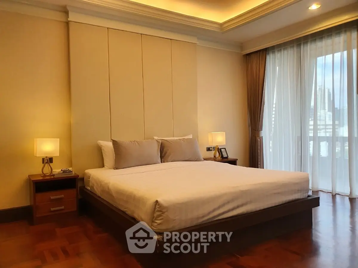 Luxurious bedroom with elegant lighting and city view