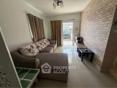 Cozy living room with modern sofa and brick accent wall