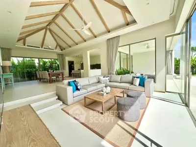 Luxurious open-plan living room with high ceilings and modern decor