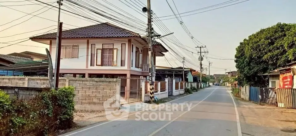 Charming suburban house with traditional architecture and spacious surroundings.