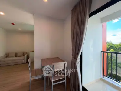 Modern apartment interior with cozy living area and balcony view