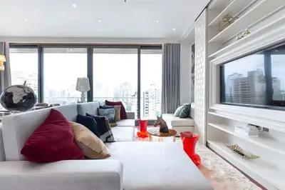 Luxurious modern living room with panoramic city views and elegant decor