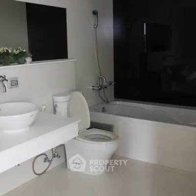 Modern bathroom with sleek fixtures and a spacious bathtub