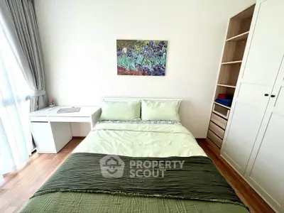 Bright and cozy bedroom with modern decor and ample storage space.