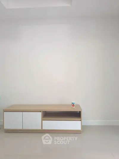 Minimalist interior with sleek wooden cabinet on glossy tiled floor