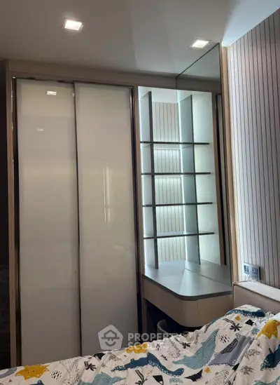 Modern bedroom with sleek wardrobe and stylish vanity mirror