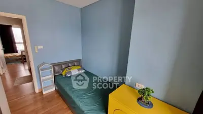 Charming small bedroom with modern decor and vibrant colors