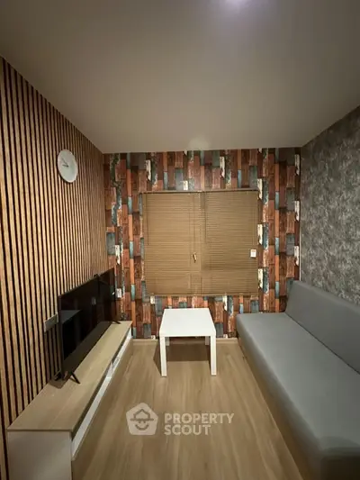 Modern living room with stylish wallpaper and minimalist furniture