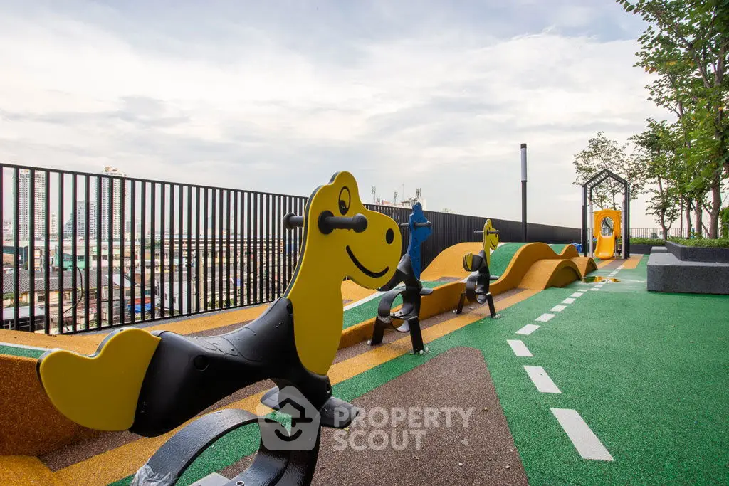 Modern rooftop playground with colorful equipment and city view